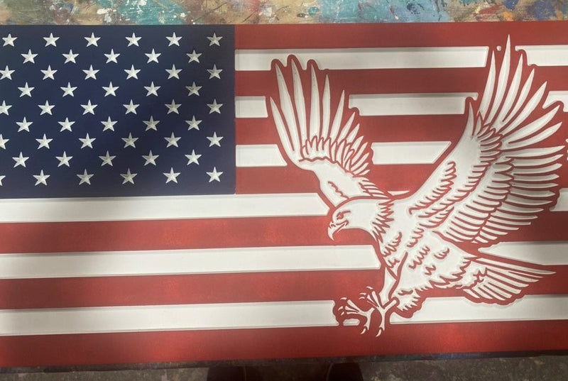 Carved wooden American Flag. This wooden flag is painted classic red, white, and blue. It also features an American Bald Eagle.